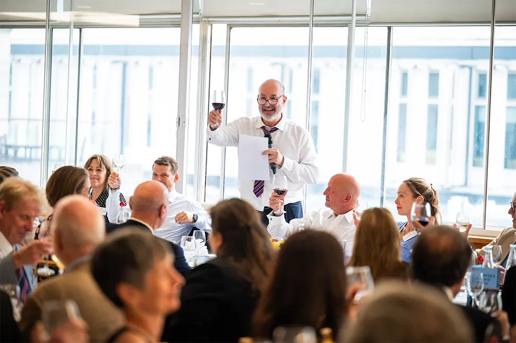 Professor Larry Kramer making a toast at the Honorary Fellows dinner