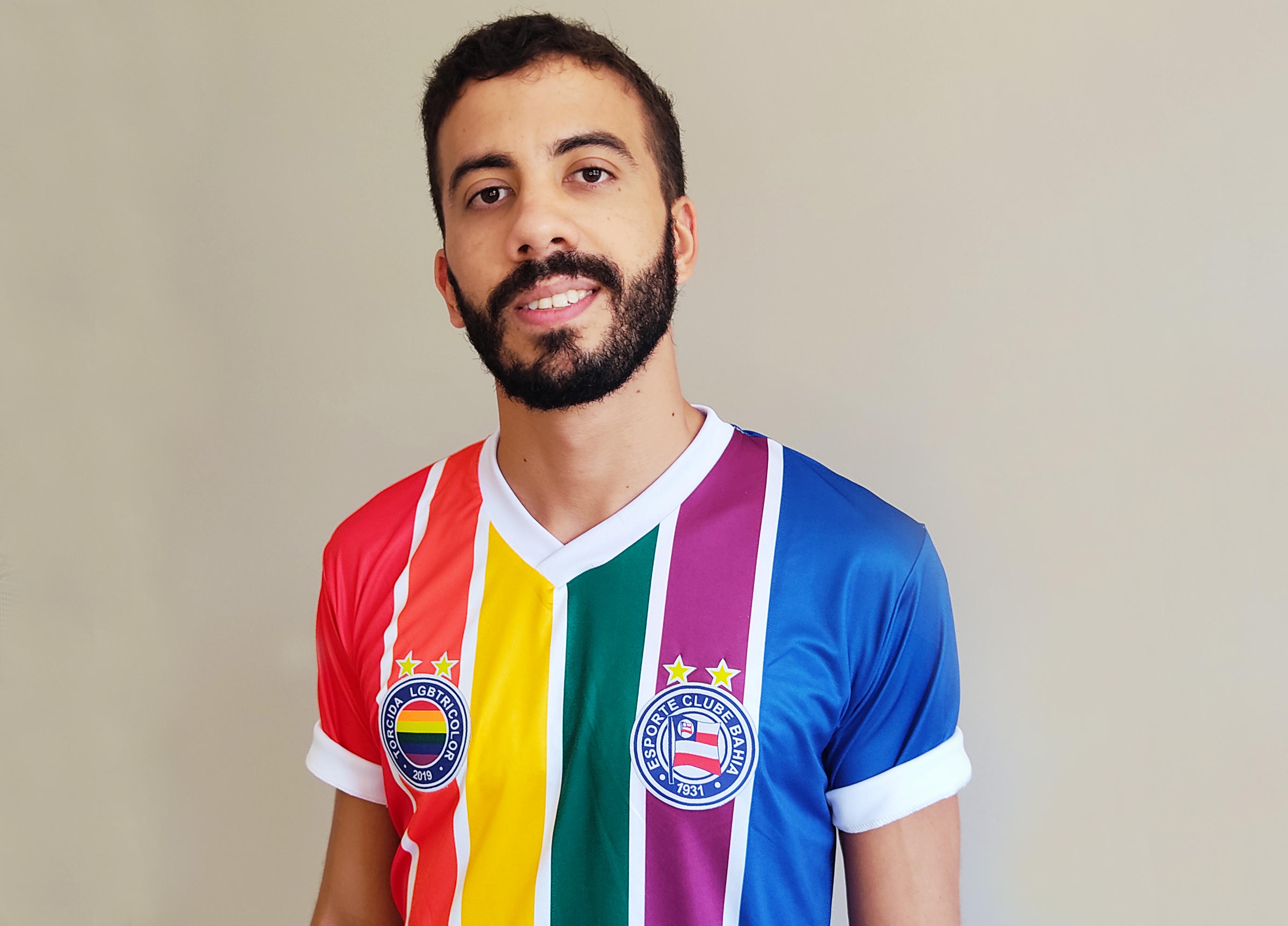Egerton Neto wears a rainbow football strip