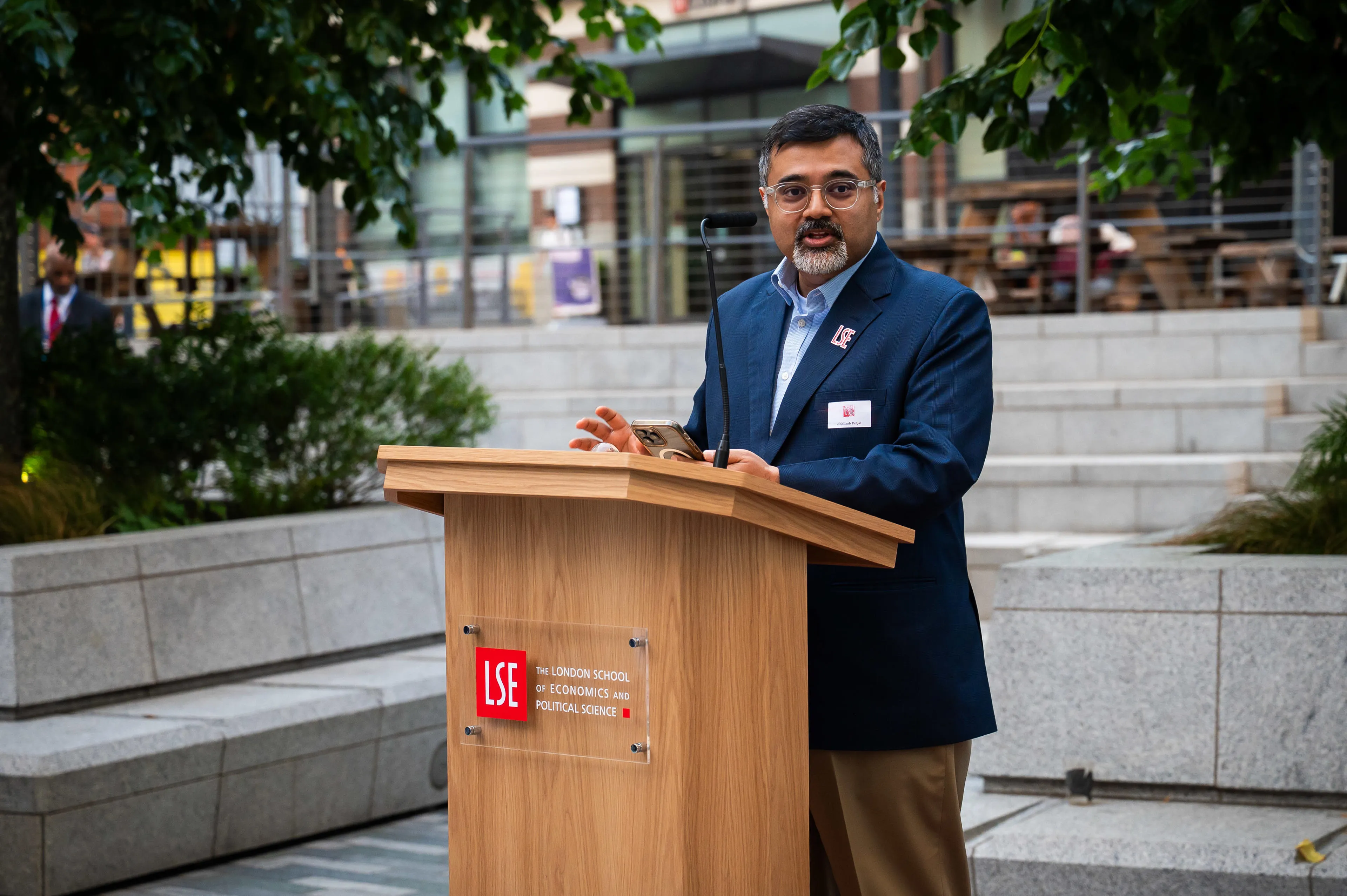 Abhilash Puljal speaking at LSE podium