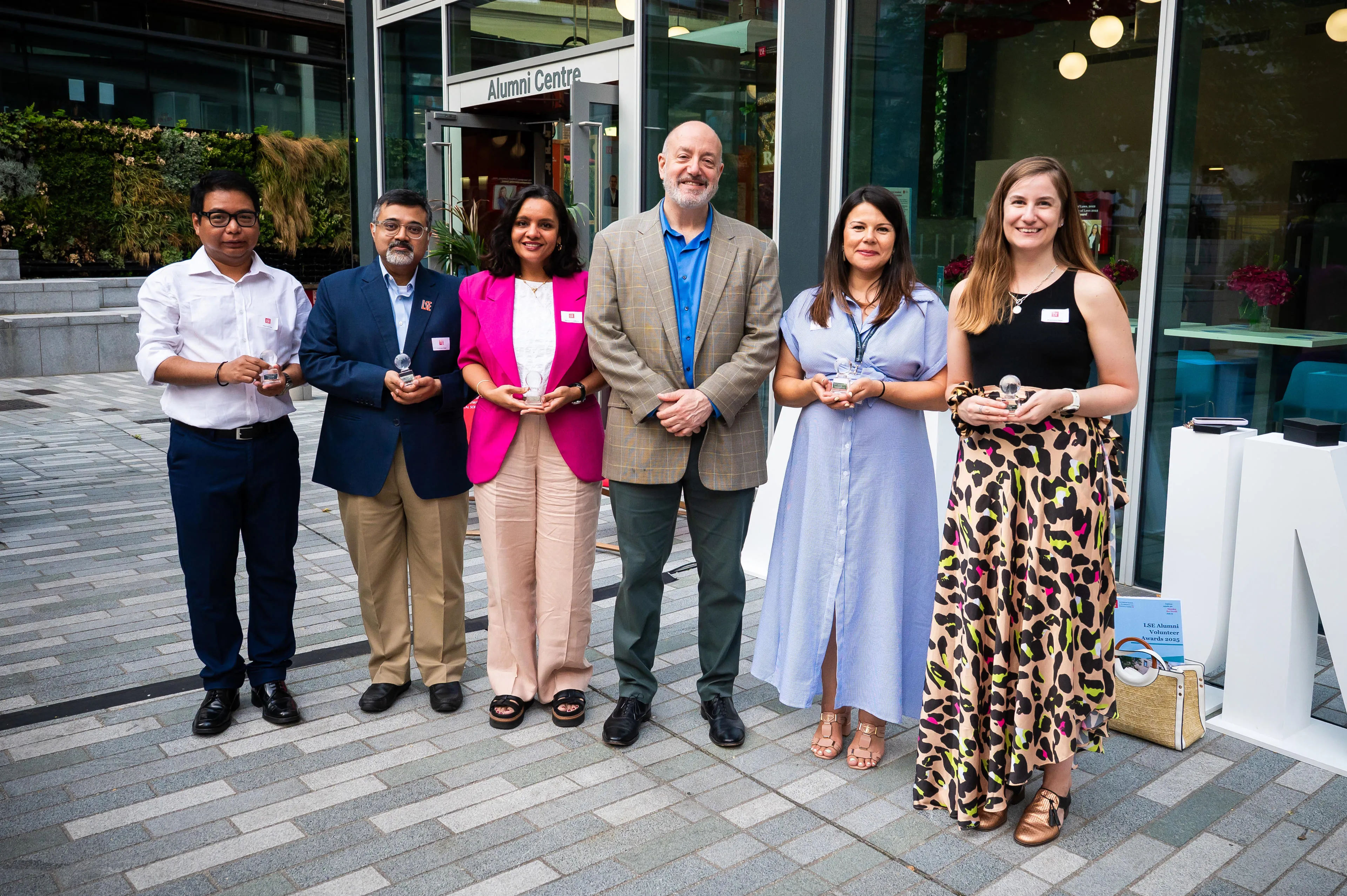 Group photo of 2025 Volunteer Alumni Award winners with Professor Larry Kramer