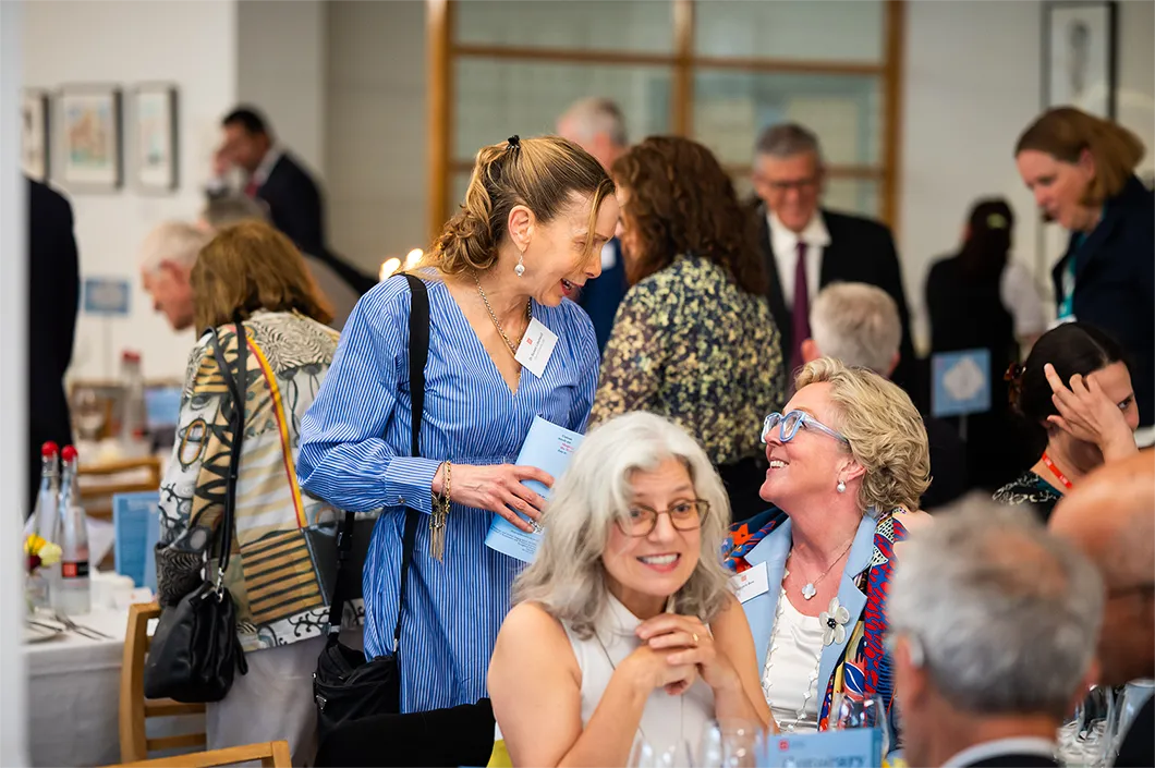 People talking and laughing at the dinner