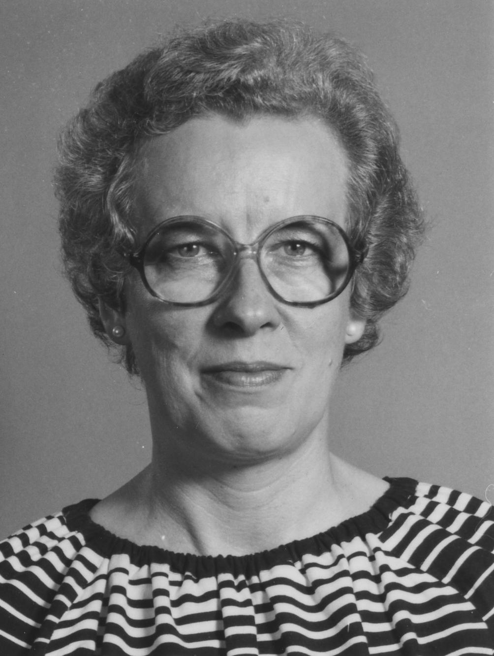 Black and white image of Jennifer Pinney, woman with short hair and glasses