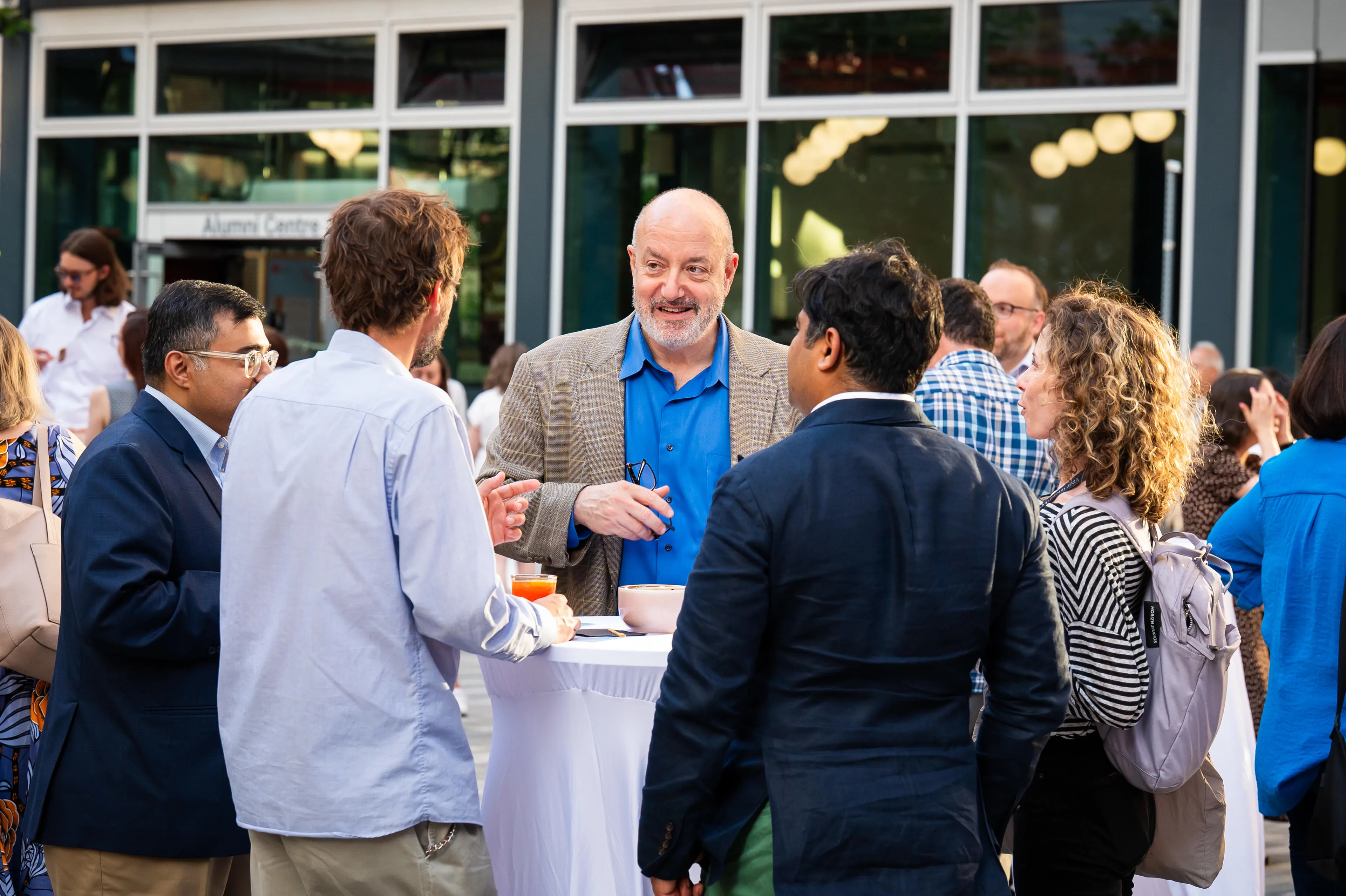 Larry Kramer chatting with LSE Alumni 