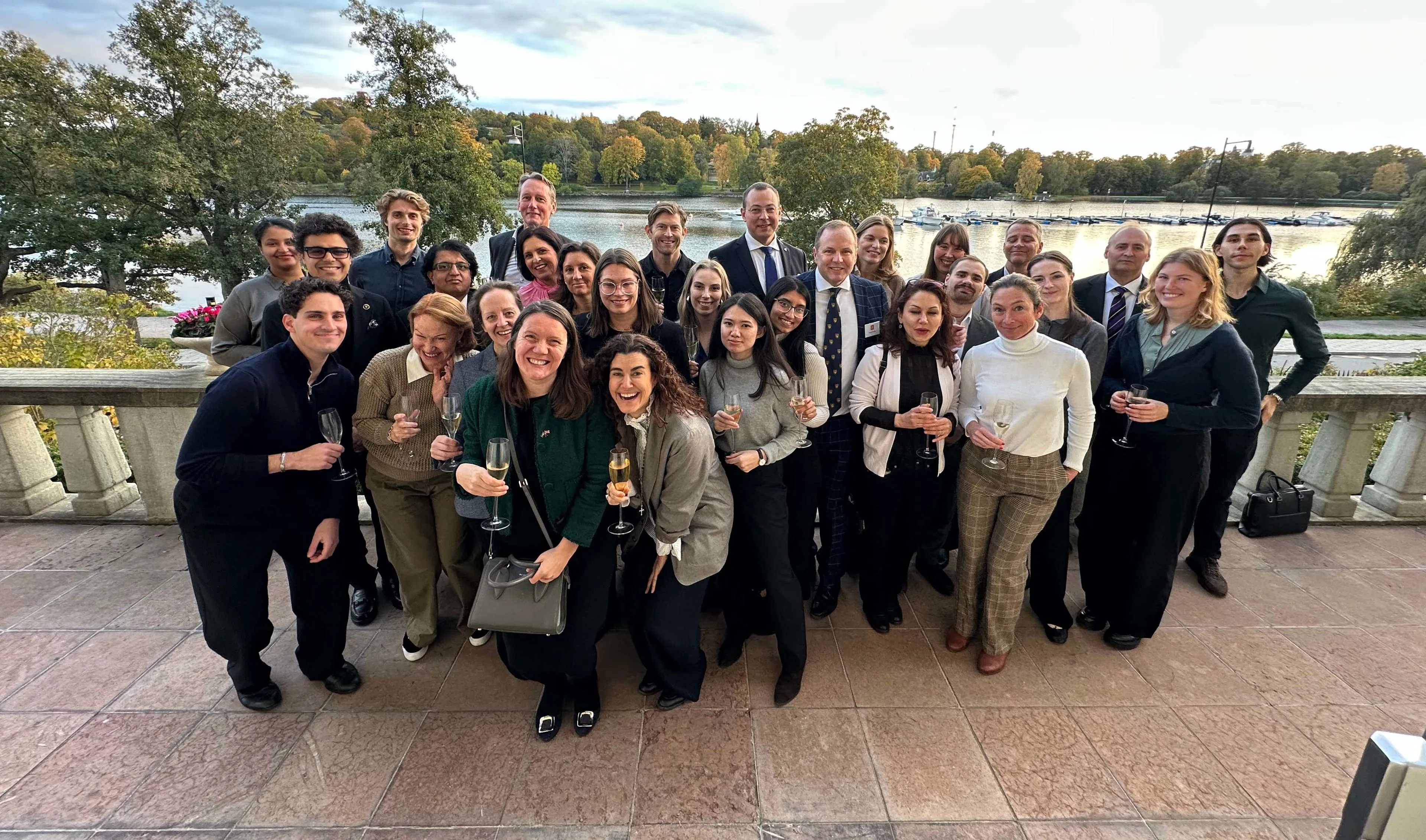 Alumni in Stockholm pose for a photo during their Welcome to the City event