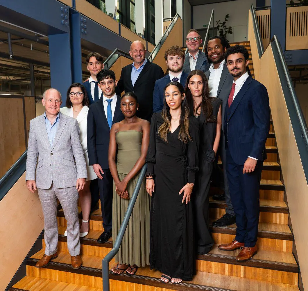 Uggla Scholars on stairs with Lance Uggla and others