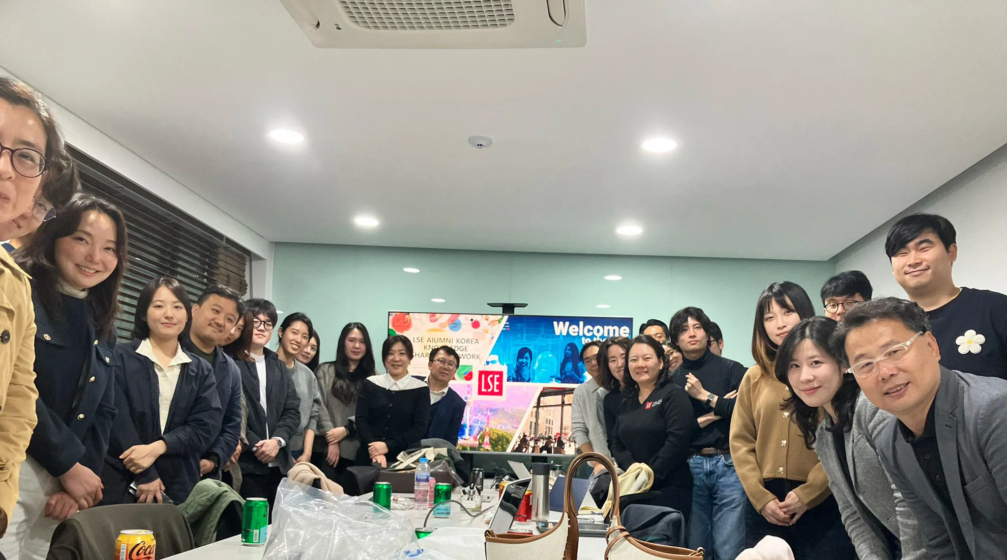 Alumni in Seoul pose for a group photo after a knowledge exchange session